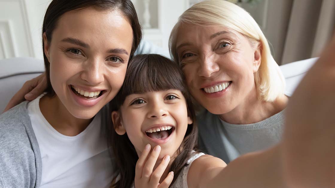 mom, daughter and grandmother smiling